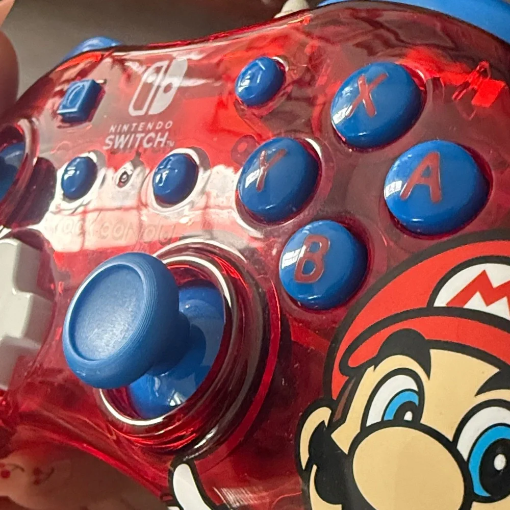 Nintendo Switch Red and Blue Controller with Mario Graphic
